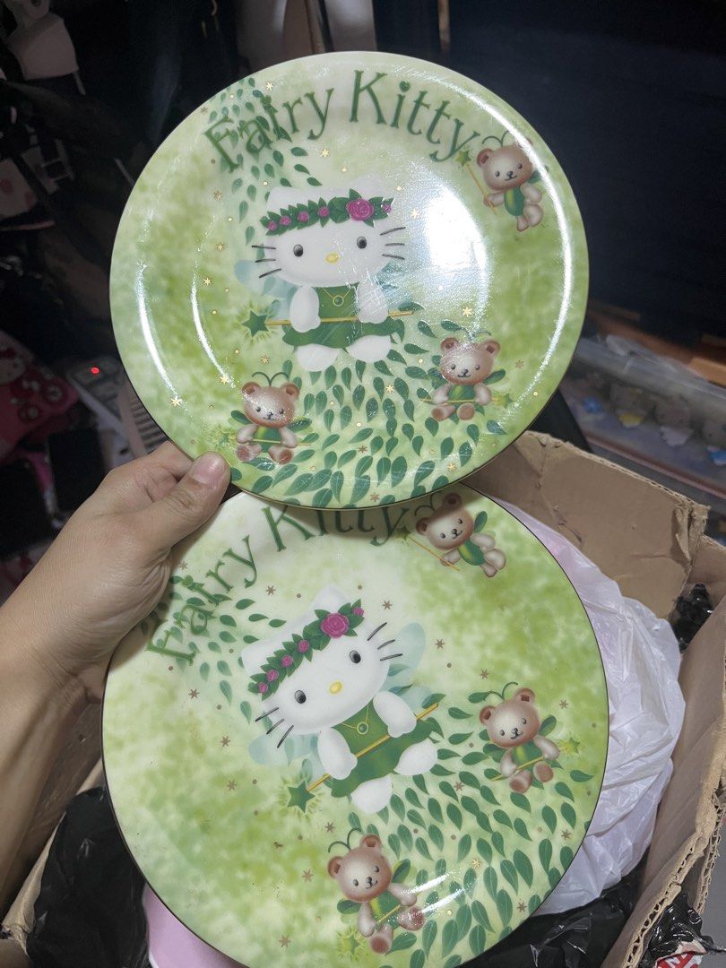 Hello Kitty Fairy Kitty green decorative plates (Category: Dinnerware & Cutlery) located in Manila. Submitted by janetecson05 (Listing ID 1470205281, Image 1). Description: - Set of 2 decorative Kitty plates - Charming green fairy theme with 'Fairy Kitty' lettering - Adorned with cute teddy bears and floral crown details - Great collectible tableware for Kitty fans - Perfect for display or gifting.