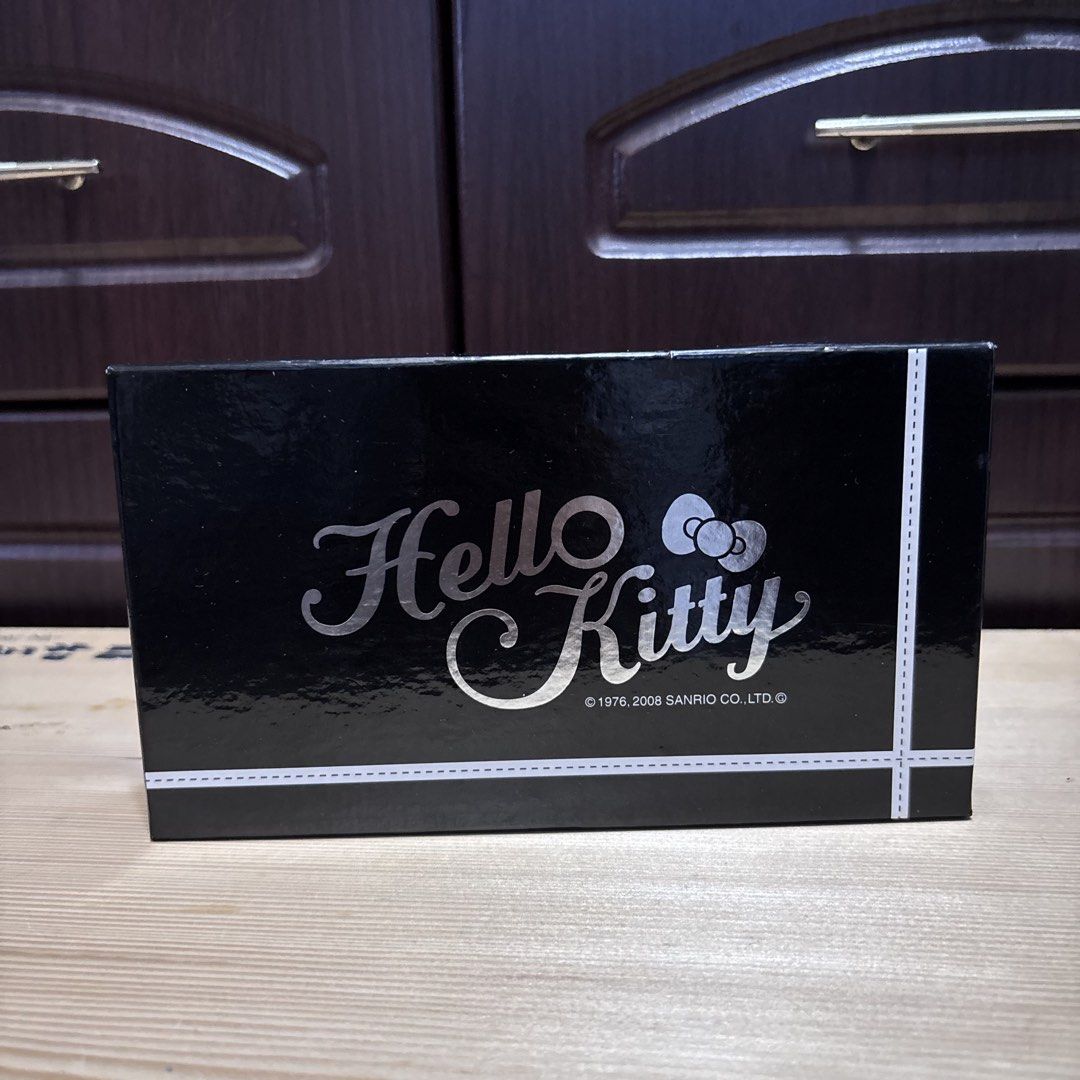 Hello Kitty Monogram Black and White Wallet with Box (Category: Wallets & Card holders) located in Manila. Submitted by nero.ph (Listing ID 1470348405, Image 2). Description: - Authentic Sanrio Kitty Monogram Wallet - Chic black and white design with KT logos and little bows - Secure snap flap closure and kiss-lock coin pouch compartment - Multiple card slots inside for easy organization - Comes complete with the original Sanrio branded black box