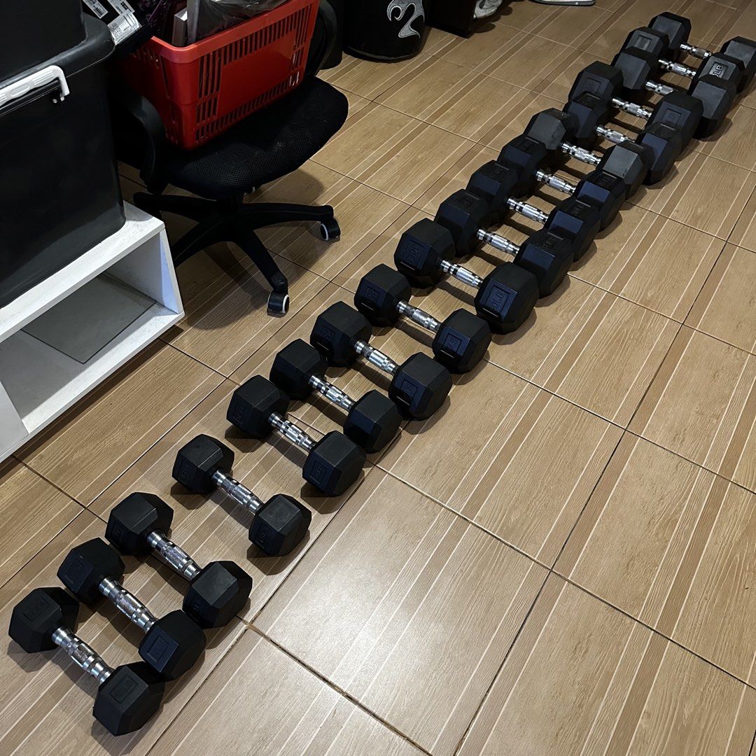 Hex Rubber Dumbbell Set with 3-Tier Rack (Category: Weights & Dumbbells) located in Batangas. Submitted by mickdc (Listing ID 1470326865, Image 3). Description: PRICE NEGOTIABLE - Complete rubber hex dumbbell set ranging from lighter weights up to 50 lbs - Includes heavy-duty 3-tier steel rack - Sturdy setup ideal for home gym workouts - Selling as a complete package only (no breaking sets) Add 800 for Barbell Rack with adjustable heights .