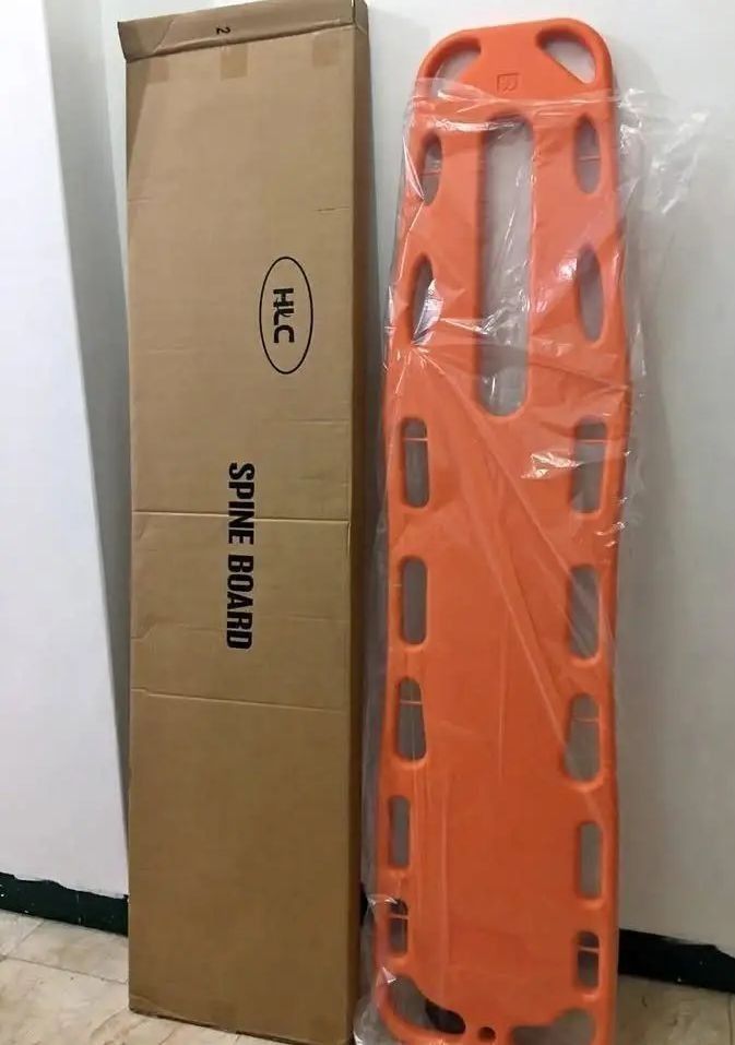 HLC Orange Spine Board Backboard Stretcher with Straps (Category: Medical Supplies & Tools) located in Manila. Submitted by hailidavid_48723a (Listing ID 1470213774, Image 2). Description: - Item: Orange plastic emergency spine board - Condition: Brand new, unused in protective plastic wrapping - Features: Multiple edge handholds, large central slot, and HLC branding - Inclusions: Black patient restraint straps with quick-release buckles and orig