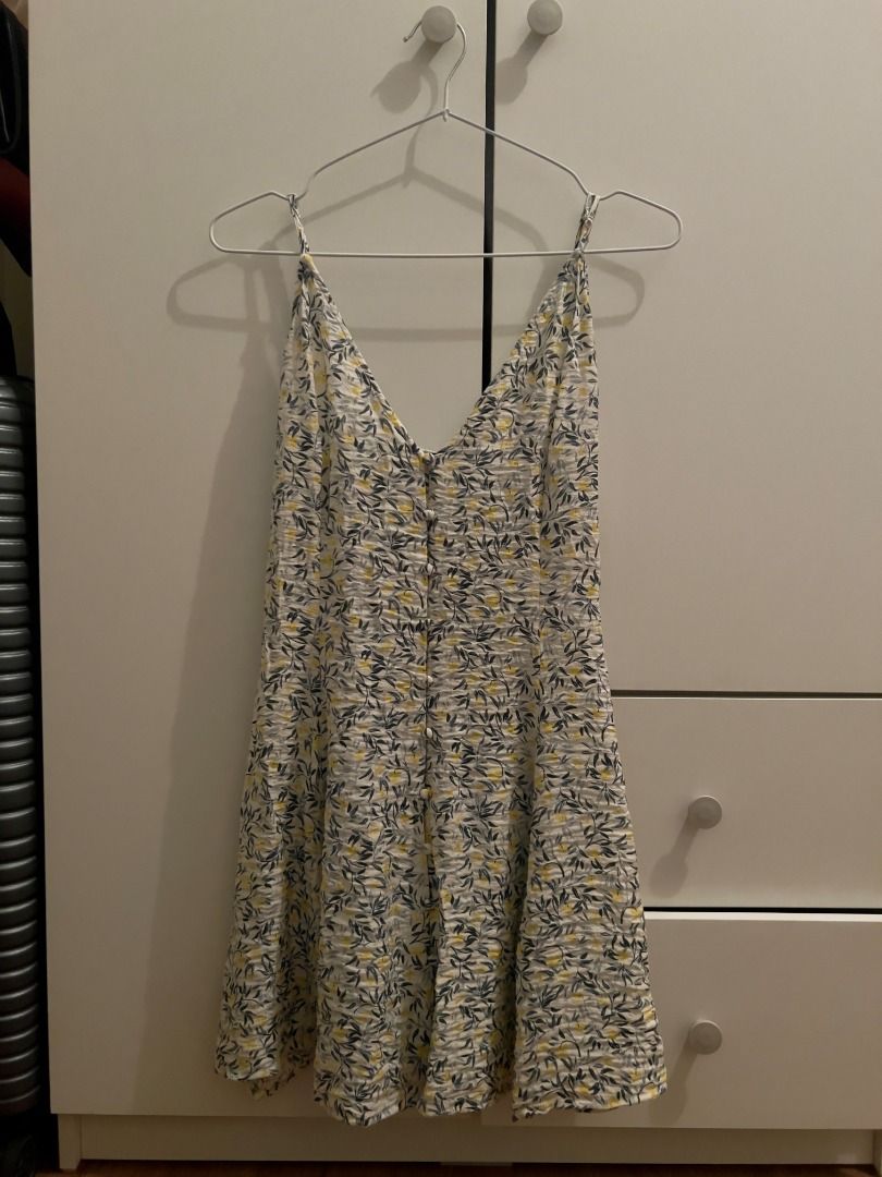 H&M A-Line Strappy Dress Size S (Category: Dresses) located in Pasig City. Submitted by shadzeedoodle (Listing ID 1470240513, Image 1). Description: - RFS: too small for me; used only 3x - Brand: H&M - Size: S - Color/Pattern: White with blue leaf and yellow flower print - Neckline & Straps: V-neck with thin adjustable straps - Details: Button-down front - Style: Light, breezy, and perfect for warm weather.