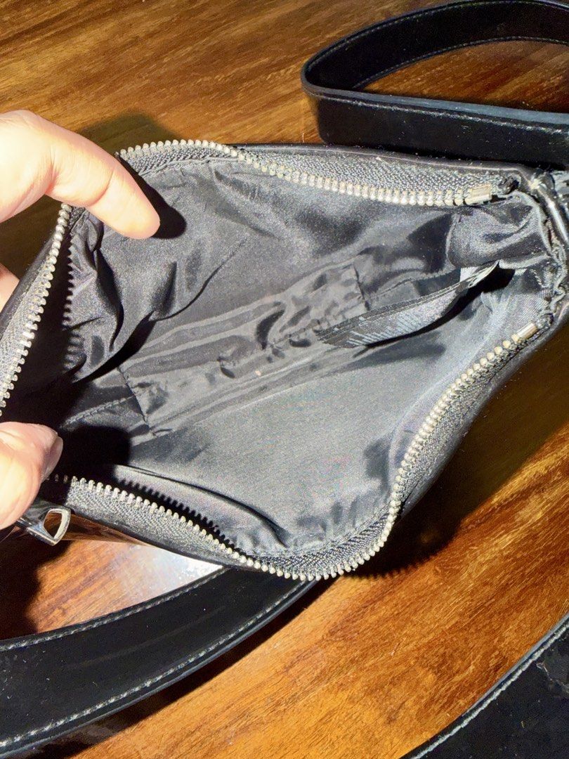 H&M Black Shoulder Bag 2-in-1 (Category: Shoulder Bags) located in Quezon City. Submitted by jikakita (Listing ID 1470170078, Image 2). Description: ✨ H&M Black 2-in-1 Crescent Shoulder Bag • Condition: Like new (used only 1-2 times, well-stored, no issues/flaws) • Color: Glossy Black Details: - Comes with two strap options: a short shoulder strap and a longer adjustable crossbody strap - Can be worn as a shoulder bag, underarm bag, or crossbody 