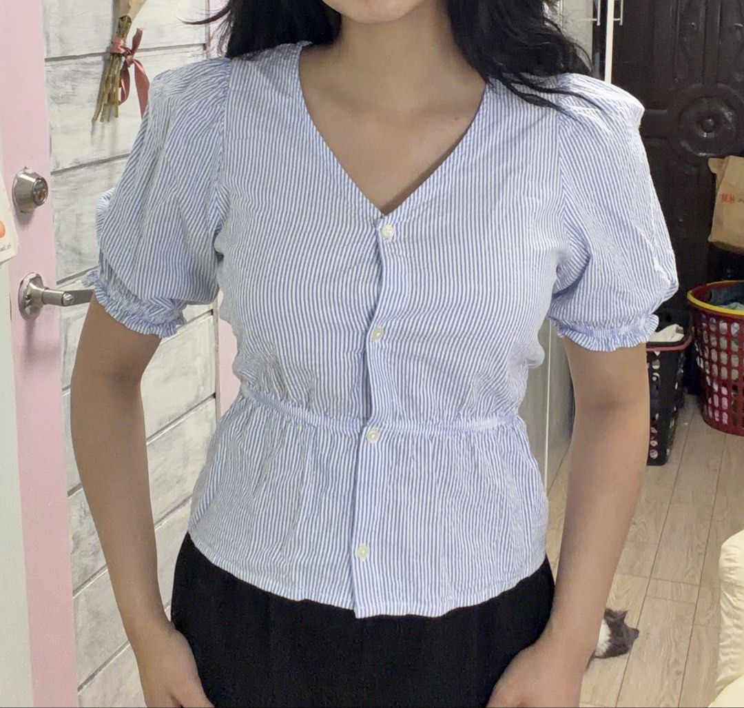 H&M Blue and White Striped Blouse Size 14A+ (Category: Blouses) located in Rizal. Submitted by kianapreloves (Listing ID 1468593485, Image 3). Description: - Brand: H&M - Design: Blue and white stripes with a flattering peplum silhouette and gathered waist - Details: Short puff sleeves, V-neckline, and functional front buttons - Material: Lightweight and breathable fabric - Styling: Easy to match with jeans, shorts, or skirts for everyday wear - 
