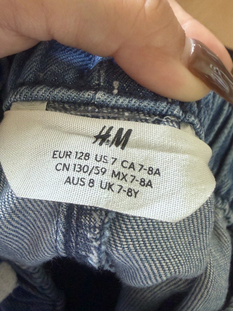 H&M Denim Shorts Size 7-8Y (Category: Babies & Kids Fashion) located in Binan City. Submitted by mrsgarcia (Listing ID 1470346558, Image 3). Description: - Brand: H&M - Item: Kids Blue Denim Shorts - Size: EUR 128, US 7, UK 7-8Y, AUS 8 - Material: Comfortable cotton blend denim - Features: Elastic waistband with white drawstring, two back pockets.