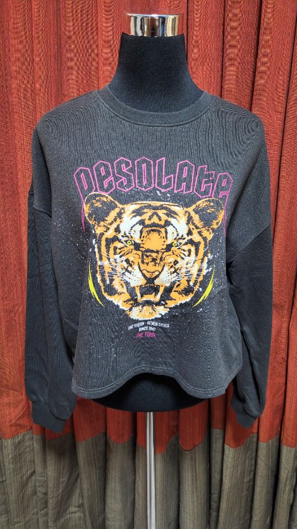 H&M Divided "Desolate" Tiger Graphic Sweatshirt (Category: Longsleeves) located in Caloocan City. Submitted by mocs.stash (Listing ID 1470177426, Image 2). Description: H&M Divided "Desolate" Tiger Graphic Sweatshirt Selling for ₱300 (SRP: ~₱1,290) Brand: H&M (Divided line) Condition: Preloved in great condition Price: ₱300 Shipping & Location Details: Location: Caloocan Shipping Fee: Paid by buyer Couriers: Grab Express, Lalamove, or GoGo Xpress