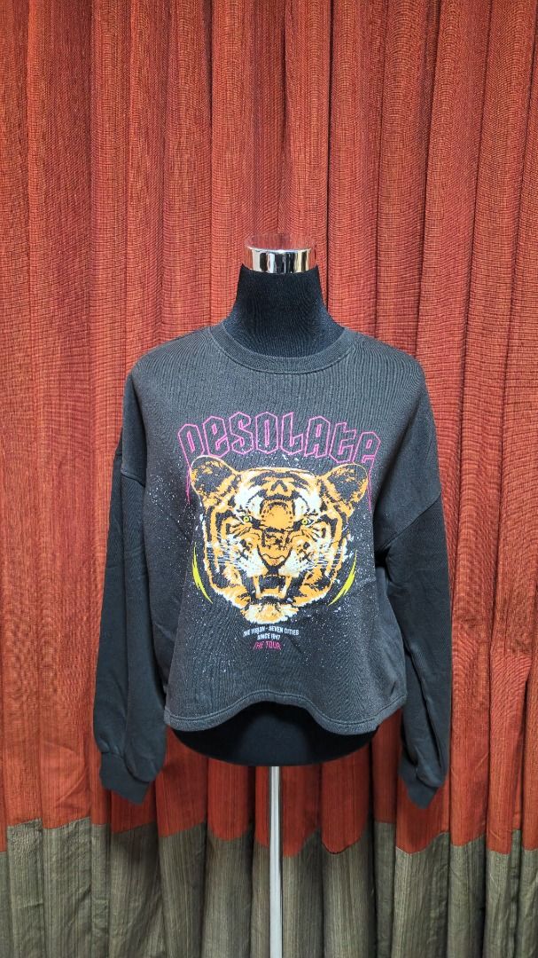 H&M Divided "Desolate" Tiger Graphic Sweatshirt (Category: Longsleeves) located in Caloocan City. Submitted by mocs.stash (Listing ID 1470177426, Image 1). Description: H&M Divided "Desolate" Tiger Graphic Sweatshirt Selling for ₱300 (SRP: ~₱1,290) Brand: H&M (Divided line) Condition: Preloved in great condition Price: ₱300 Shipping & Location Details: Location: Caloocan Shipping Fee: Paid by buyer Couriers: Grab Express, Lalamove, or GoGo Xpress