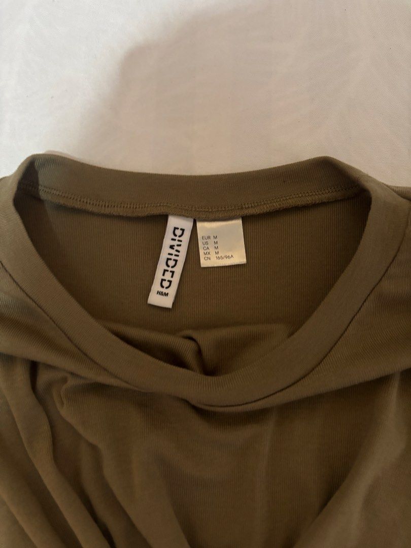 H&M Olive Green Wrap Detail Top (Category: Shirts) located in Bulacan. Submitted by shandeclutterx (Listing ID 1470222269, Image 3). Description: Classy wrap top from H&M with gold detailing. This was an impulse buy and has never been worn yet. It can be worn in the office too sice it looks classy. M on tag but fits a size S.