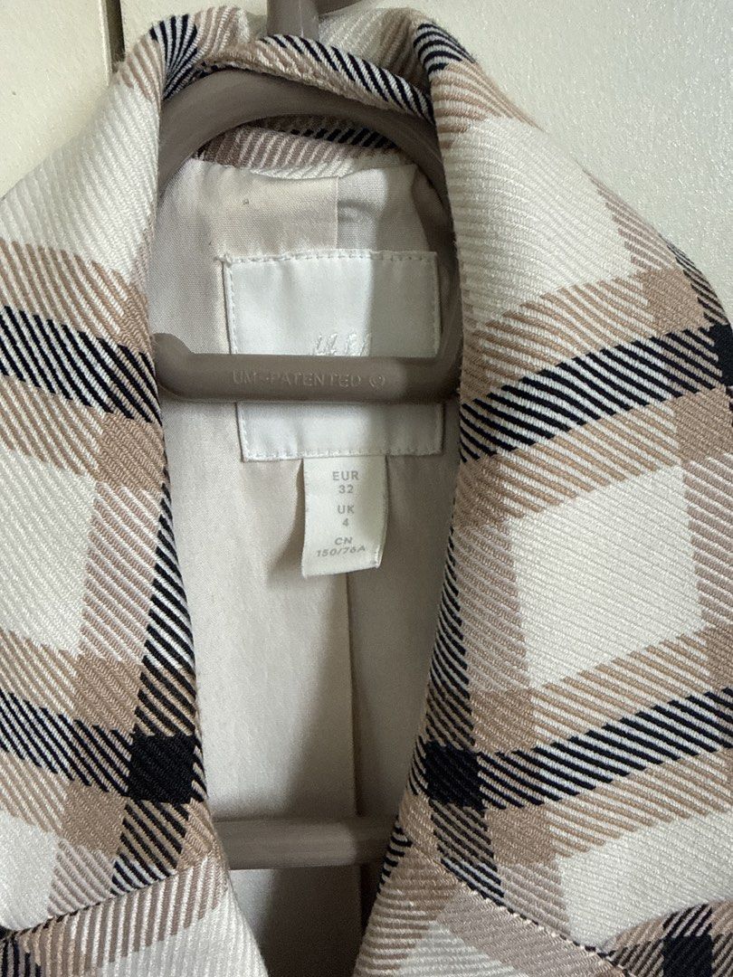 H&M Plaid double-breasted blazer jacket (Category: Coats, Jackets and Outerwear) located in Pasig City. Submitted by helpmedispose (Listing ID 1470169938, Image 3). Description: - Style: Double-breasted plaid blazer (white, beige, and black) - Fit: Classic tailored fit, fully lined - Details: Structured lapels, two front flap pockets, tortoise-style buttons - Fabric: Good weight with crisp pattern alignment - Versatility: Perfect for workwear or 