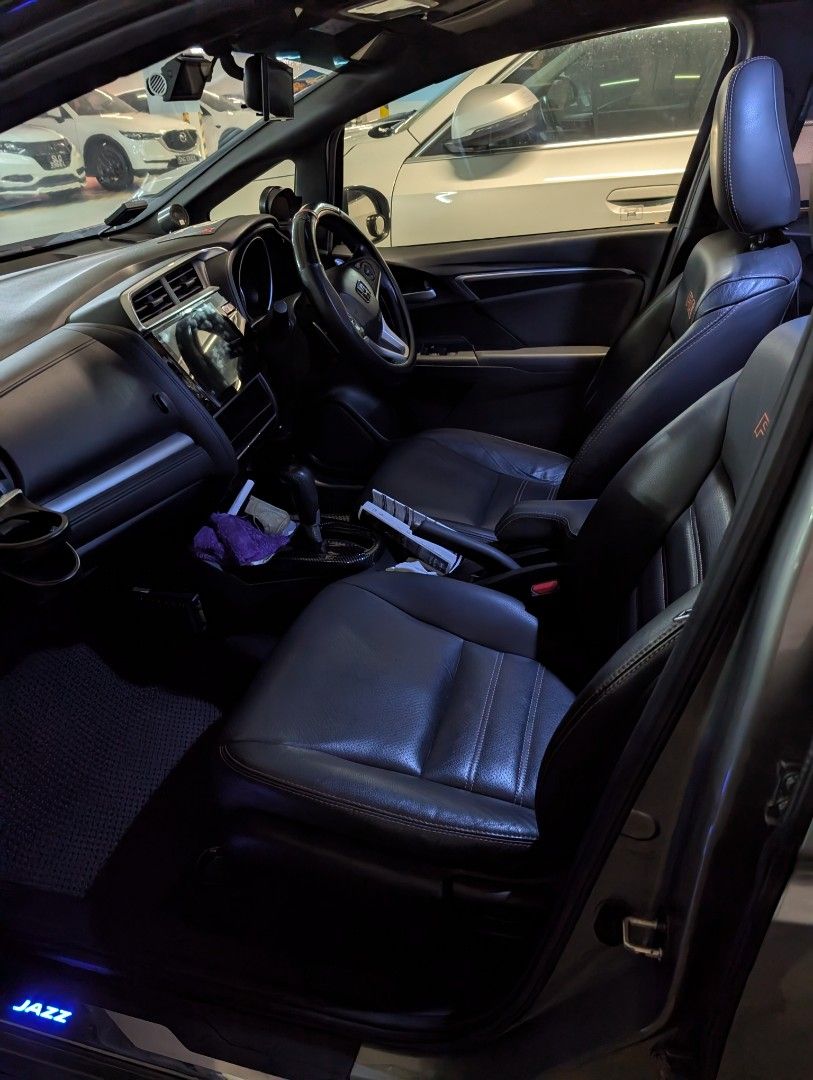 Honda Jazz 1.5 RS (A) (Category: Used Cars) located in Singapore. Submitted by cycy3 (Listing ID 1470207526, Image 2). Description: good condition, good for COE renewal or short term drive, 5 months left. selling since I plan to buy a new car. Android auto/apple carplay screen installed, front and back rear camera recording. has additional tanabe exhaust installed by previous owner with certificate. Servicing done on end Aug 2026 road tax paid fo