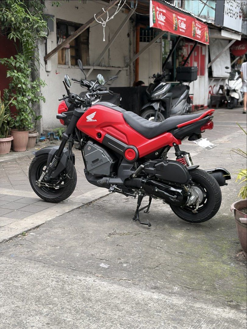 Honda Navi Motorcycle Scooter Red (Category: Motorbikes for Sale) located in Manila. Submitted by mr.muscleqo (Listing ID 1470166200, Image 3). Description: Honda navi 2026 model 8k+ mileage Complete original papers Registered until 2028 First owner acquired With 2 valid id’s and 3 signature 2 keys Open Dos ₱49k Upgraded parts - RCB Shock - Round classic side mirror - Tail tidy - Retro Custom Seat - Digital panel gauge - LED headlights / Signal l