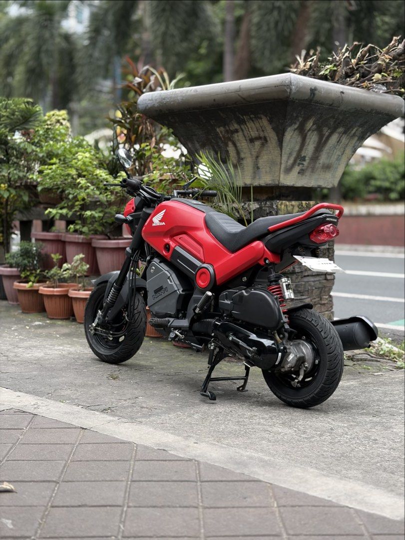 Honda Navi Motorcycle Scooter Red (Category: Motorbikes for Sale) located in Manila. Submitted by mr.muscleqo (Listing ID 1470166200, Image 2). Description: Honda navi 2026 model 8k+ mileage Complete original papers Registered until 2028 First owner acquired With 2 valid id’s and 3 signature 2 keys Open Dos ₱49k Upgraded parts - RCB Shock - Round classic side mirror - Tail tidy - Retro Custom Seat - Digital panel gauge - LED headlights / Signal l
