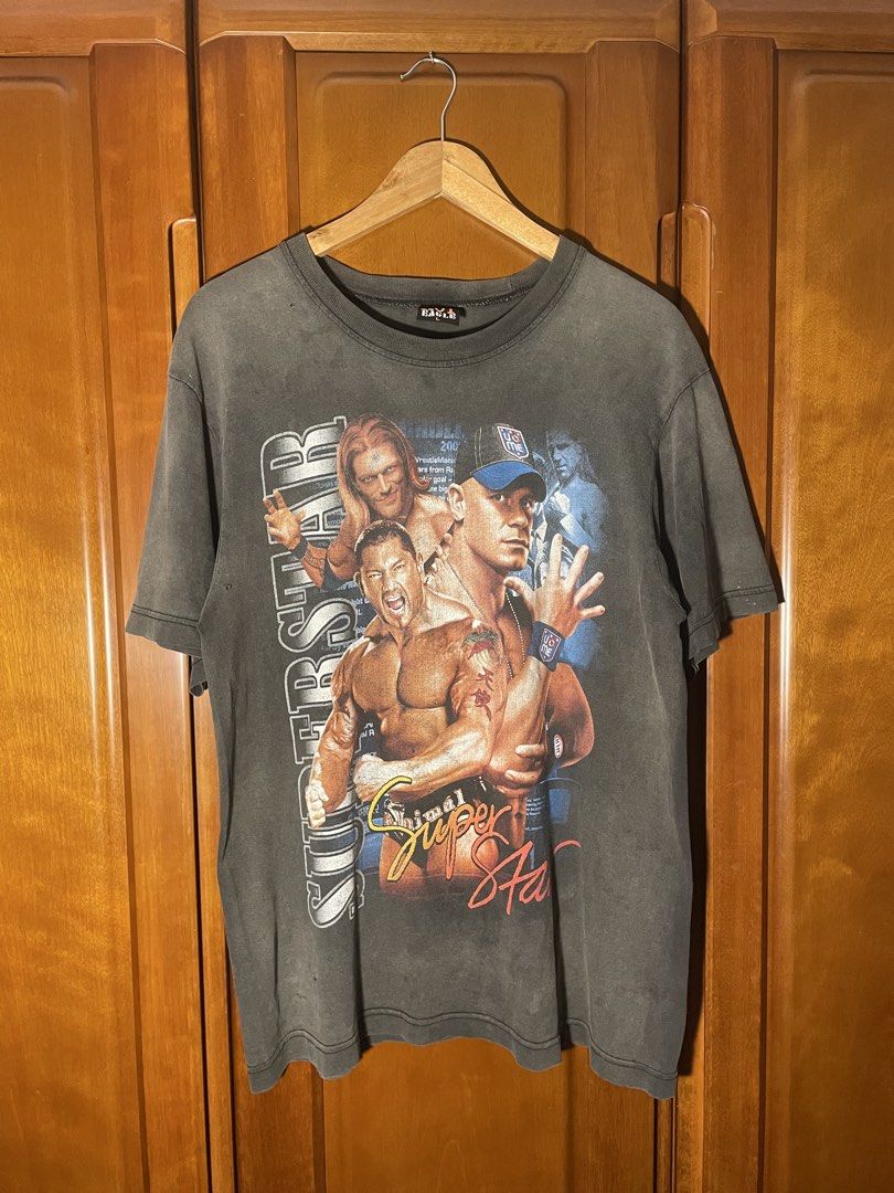HOT EAGLE WWE Superstar (Category: Tshirts & Polo Shirts ) located in Rizal. Submitted by freshthrift (Listing ID 1470323467, Image 1). Description: - Vintage washed black WWE - Features John Cena, Batista, Edge, and other superstars on front and back - Hot Eagle brand tag Dimes: 21.5x29 Issue hairlines/ pinholes 1200 nego.
