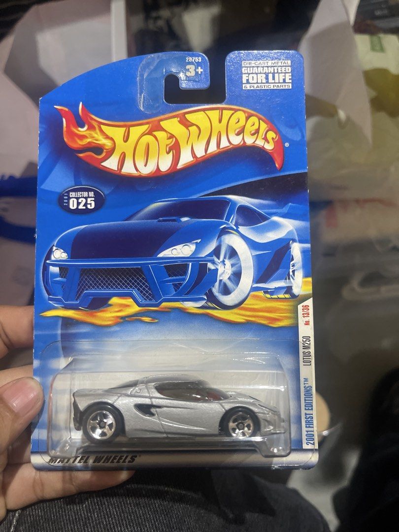 Hot Wheels 2001 First Editions Lotus M250 (Category: Vehicle & Diecast Models) located in Marikina City. Submitted by starlettonabudget (Listing ID 1470199385, Image 1). Description: - Brand: Hot Wheels - Model: Lotus M250 (2001 First Editions) - Collector Number: 025 (13/36 in series) - Color/Finish: Silver with black windows - Condition: Brand new, unopened, factory sealed on original blue card - Perfect for collectors and die-cast enthusiasts.