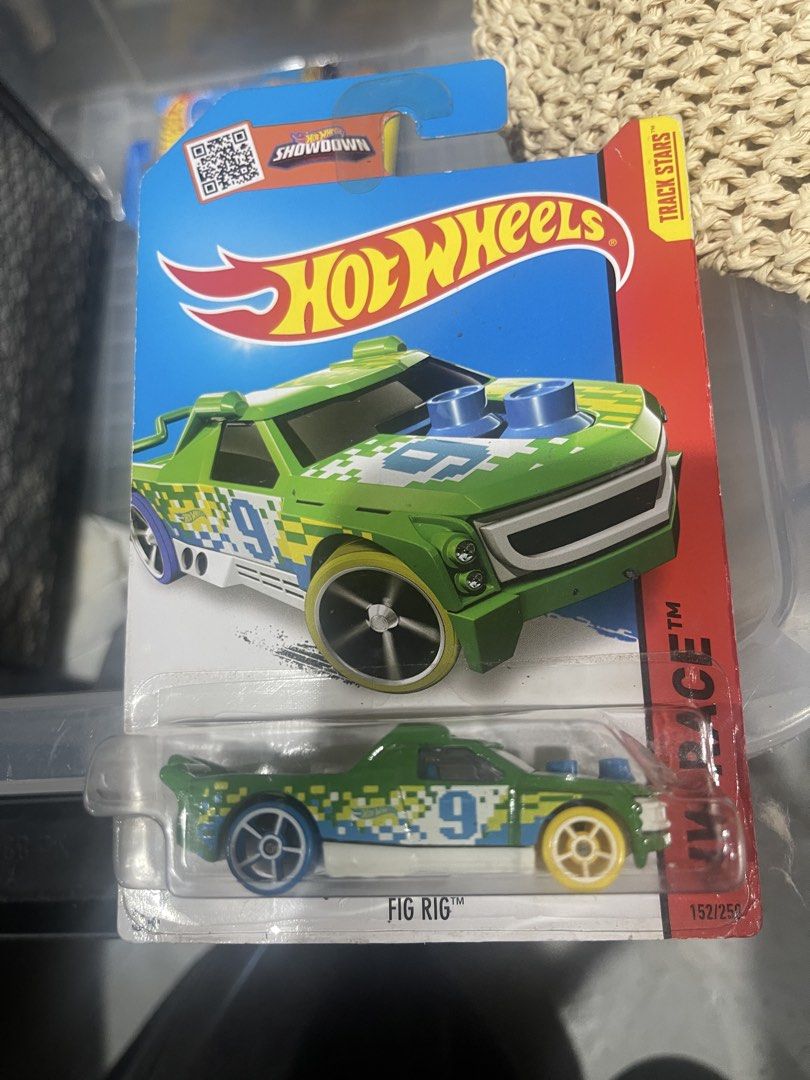 Hot Wheels Fig Rig Track Stars 152/250 (Category: Vehicle & Diecast Models) located in Marikina City. Submitted by starlettonabudget (Listing ID 1470258021, Image 1). Description: - Brand: Hot Wheels - Model: Fig Rig (Track Stars Series, 152/250) - Color/Design: Green with pixelated digital camo and number 9 - Details: Blue hood stacks, yellow front wheels, purple rear wheels - Condition: Brand new, still sealed in original blister pack - Perfect