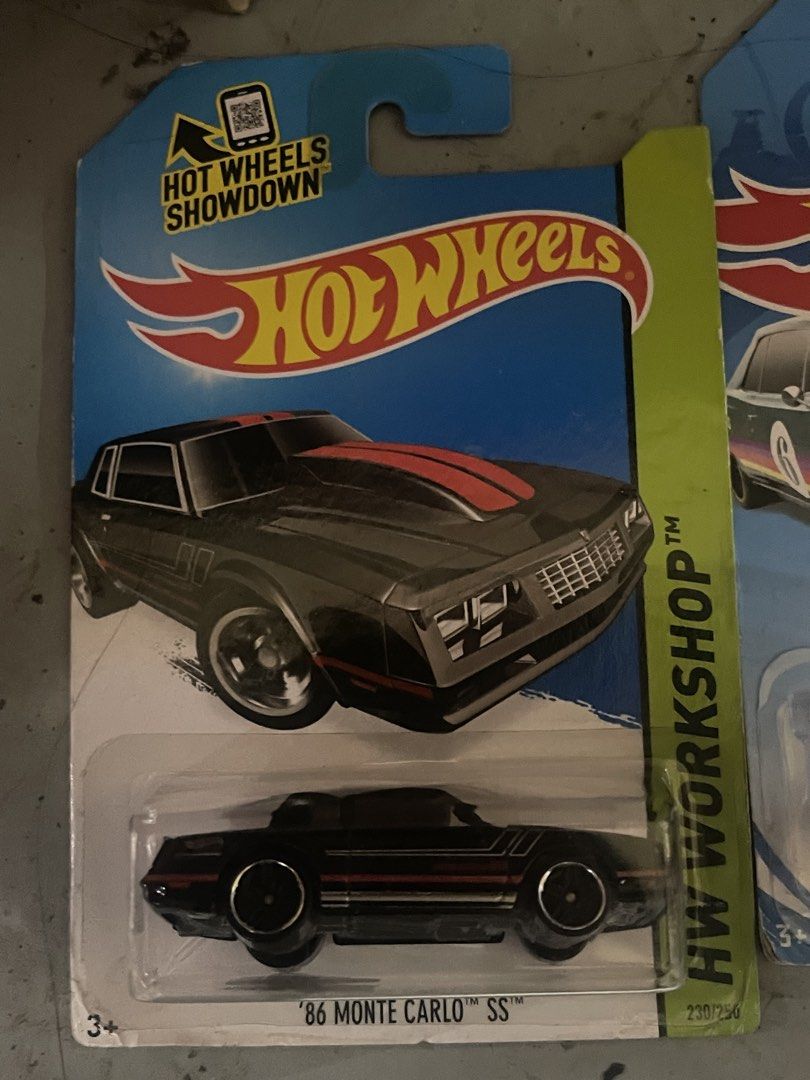 Hot Wheels HW Workshop '86 Monte Carlo SS (Category: Vehicle & Diecast Models) located in Marikina City. Submitted by starlettonabudget (Listing ID 1470224235, Image 1). Description: - Brand: Hot Wheels - Model: '86 Monte Carlo SS - Series: HW Workshop (Collector #230/250) - Color/Design: Black with red hood and side stripes - Condition: Brand new, unopened blister pack with original cardboard backing.