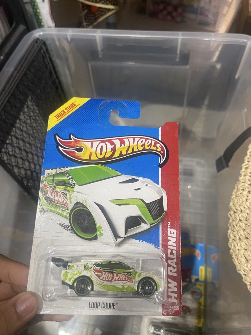 Hot Wheels Loop Coupe HW Racing Track Stars (Category: Vehicle & Diecast Models) located in Marikina City. Submitted by starlettonabudget (Listing ID 1470260255, Image 1). Description: - Brand: Hot Wheels - Model: Loop Coupe (HW Racing / Track Stars) - Color/Design: White and green graphics with black wheels and rear spoiler - Condition: Brand new, unopened blister pack with original cardboard packaging - Ideal for: Collectors and track set play.