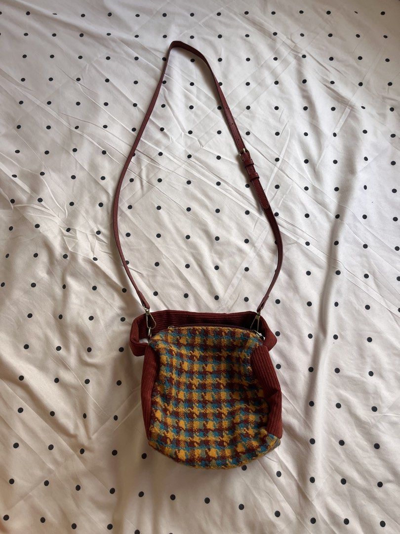 Houndstooth Pattern Crossbody Bag with Corduroy Trim and Strap (Category: Cross-body Bags) located in Manila. Submitted by chimcheese (Listing ID 1470154252, Image 1). Description: - Eye-catching multi-colored houndstooth pattern in blue, yellow, and brown - Stylish deep red corduroy trim and matching red adjustable faux leather strap - Convenient lobster clasp strap attachments for easy removal - Secure zip-top closure to keep your belongings sa