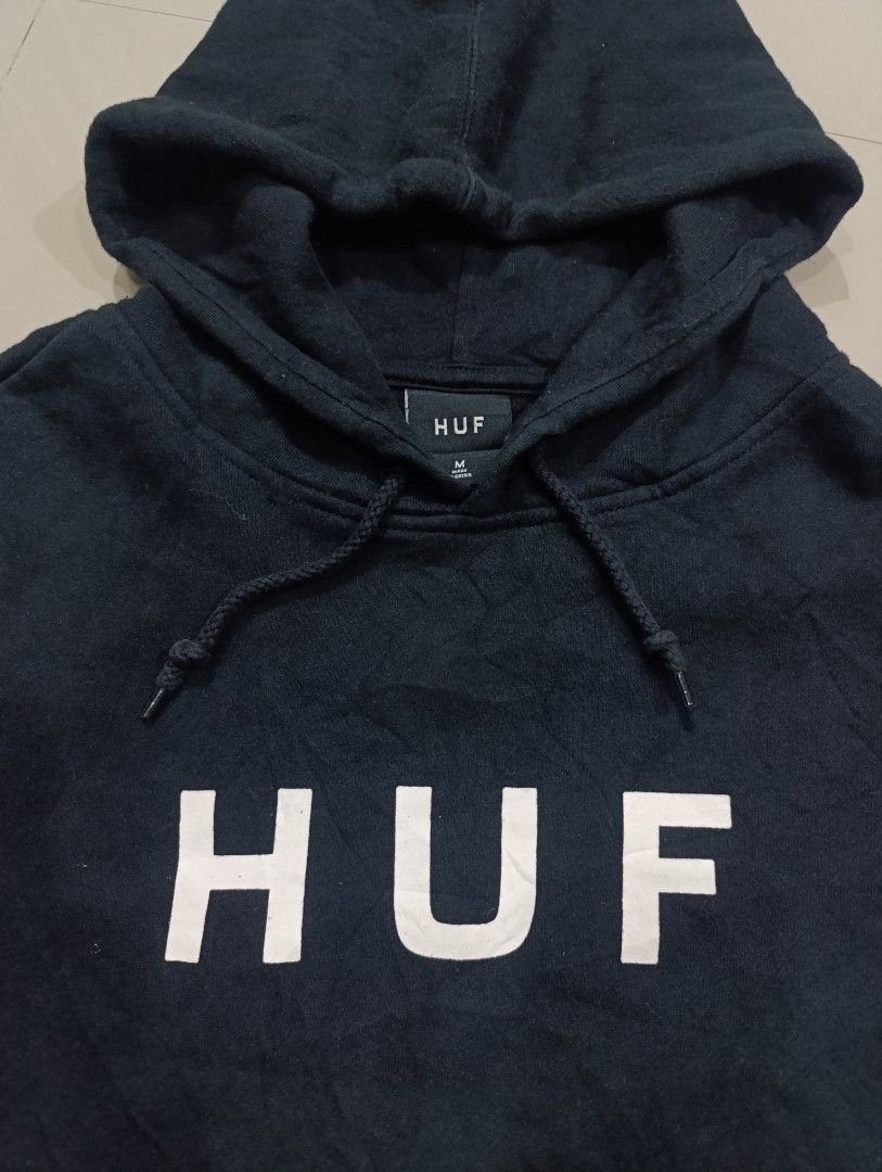 HUF OG Logo Hoodie (Category: Hoodies) located in Davao. Submitted by idioticthrifter (Listing ID 1470332248, Image 2). Description: - Brand: HUF - Color: Classic Black with White Box Logo - Size: Medium (M) 22 x 28 - Material: 80% Cotton, 20% Polyester (Heavyweight fleece lining) - Features: Adjustable drawstring hood and front kangaroo pocket - Style: Casual streetwear, easy to layer - Condition: Excellent.