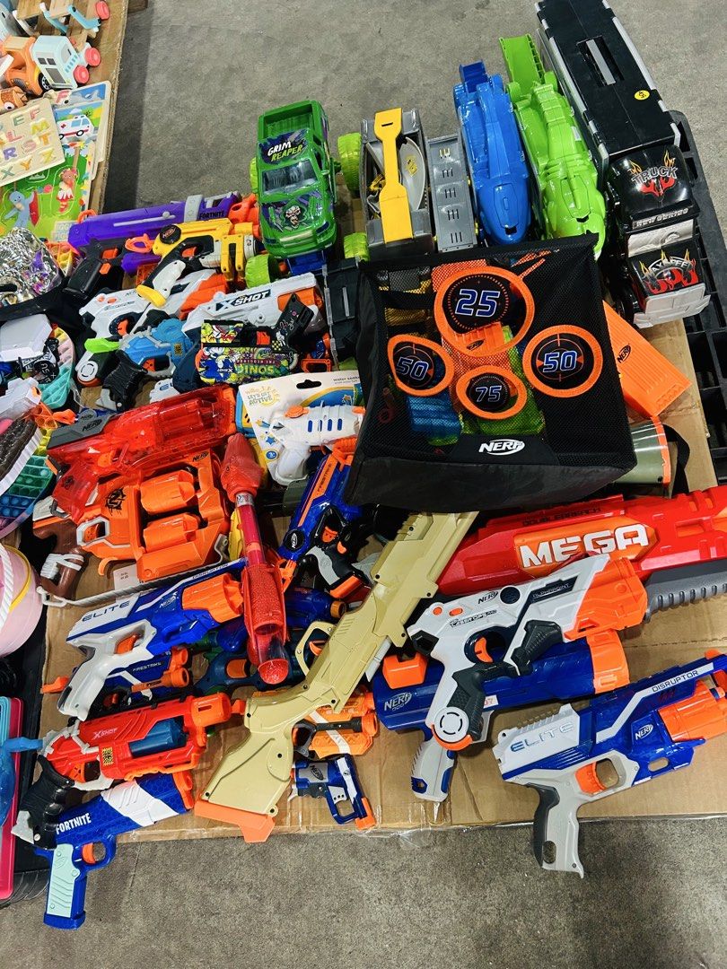 Huge Nerf and X-Shot Toy Blaster Target Set (Category: Action & Battle Toys) located in Manila. Submitted by starbalesukandjapansurplus (Listing ID 1470347858, Image 1). Description: - Massive toy bundle: Includes multiple Nerf Elite, Mega, and Laser Ops models plus X-Shot blasters - Vehicles & Target: Comes with several toy trucks and a hanging target net - Colors: Assorted mix of blue, orange, white, and red - Ideal for: Backyard target practic