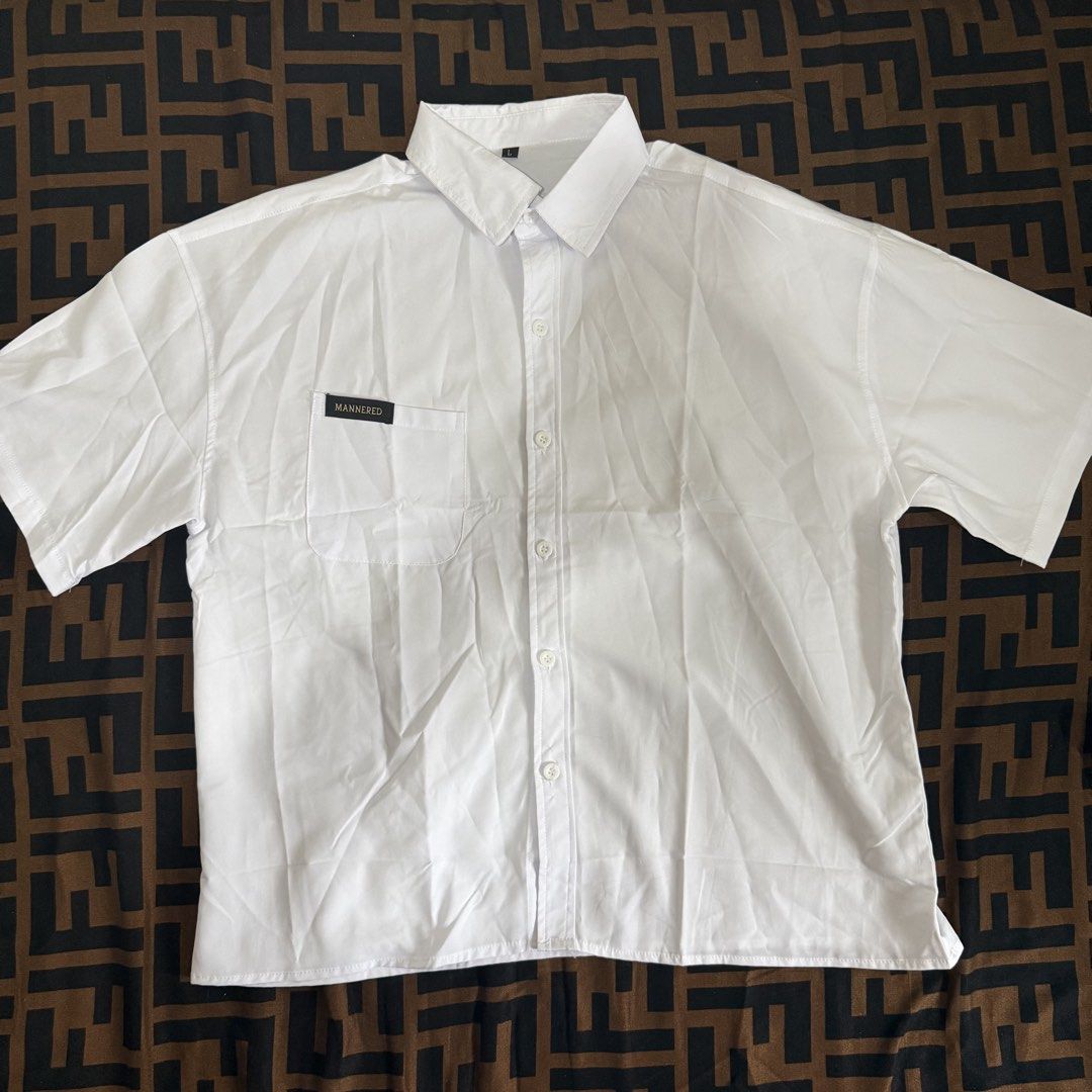 HUILISHI / Mannered Boxy Polo (Category: Tshirts & Polo Shirts ) located in Cainta. Submitted by amswardrobe (Listing ID 1470192033, Image 1). Description: - Brand: Mannered - Design: Cropped/Boxy - Size: Large - Style: Short sleeve button-up with standard collar and front pocket - Condition: Clean, excellent, and ready to wear Colors: White, Black, Army Green and Khaki 180 each 1K take all (6pcs).