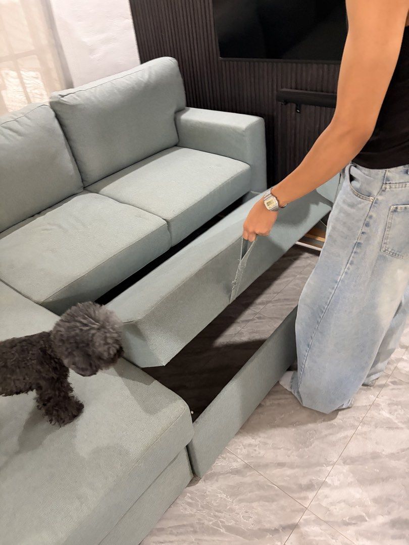 Ikea L-Shaped Sofa Bed (Category: Sofas) located in Taguig. Submitted by jesrm (Listing ID 1470251722, Image 3). Description: - Color: Light sage green - Material: Comfortable fabric upholstery with removable cushions - Features: Built-in pull-out bed Has few stains .