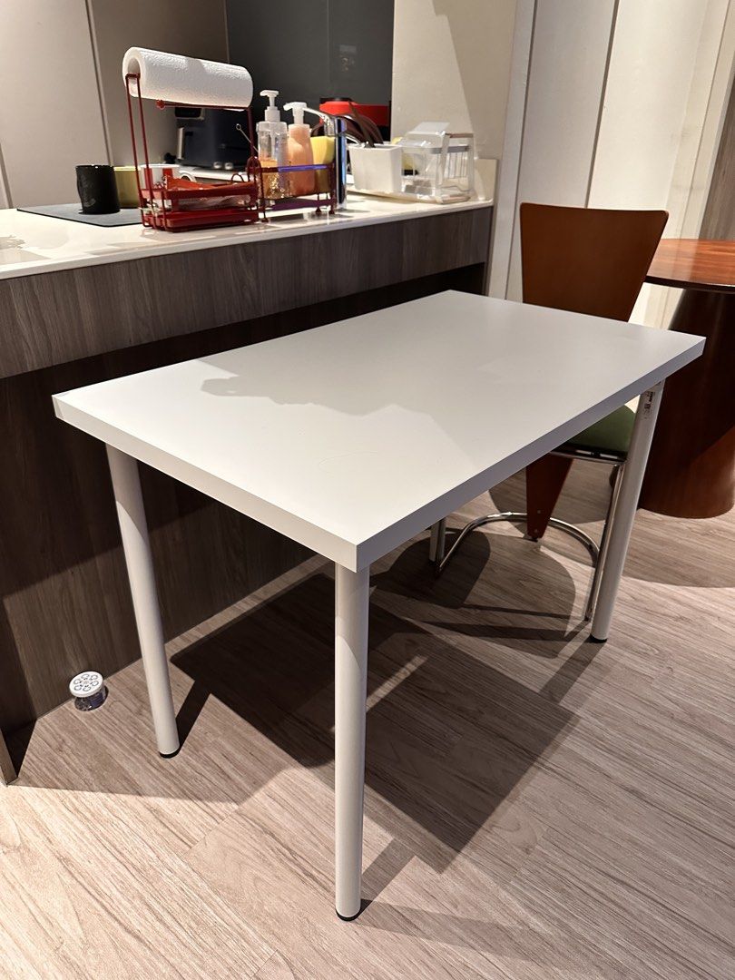 Ikea Study/Dining Table (Category: Tables & Sets) located in Singapore. Submitted by hotpinkeggs (Listing ID 1470313101, Image 2). Description: - Color & Shape: White rectangular tabletop with matching round white metal legs - Size: Compact design, perfect for small dining areas or kitchens - Maintenance: Smooth, easy-to-wipe surface for hassle-free cleaning - Condition: Very good Arrange your own pickup/delivery.