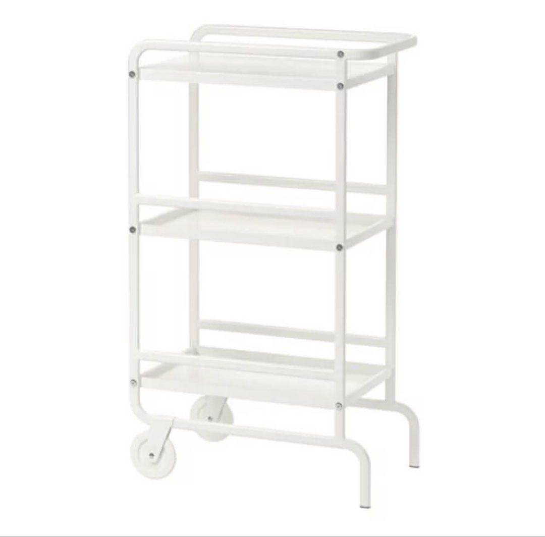 IKEA SUNNERSTA Trolley/ Utility White Cart (Category: Shelves, Cabinets & Racks) located in Angeles City. Submitted by holyfabclothing (Listing ID 1470225006, Image 1). Description: - 3-tier white metal utility cart for instant extra storage - Slim rolling design fits narrow spaces like kitchens and bathrooms - Equipped with two front wheels and back legs for stability - Raised shelf edges prevent items from falling off - Clean, modern look that 