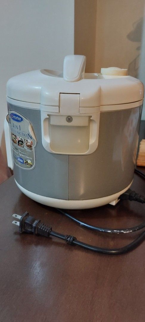Imarflex 4-in-1 Multi-Function Rice Cooker 1.2 Liters (Category: Cookers) located in Antipolo. Submitted by kdens21 (Listing ID 1470299210, Image 2). Description: - Brand: Imarflex - Capacity: 1.2 Liters (up to 7 cups) - Color: Grey and White exterior - Multi-function: Rice cooker, warmer, steamer, and shabu-shabu - Pot: Non-stick inner pot with cup and liter measurement markings - Inclusions: Detachable power cord - Condition: Clean interior and