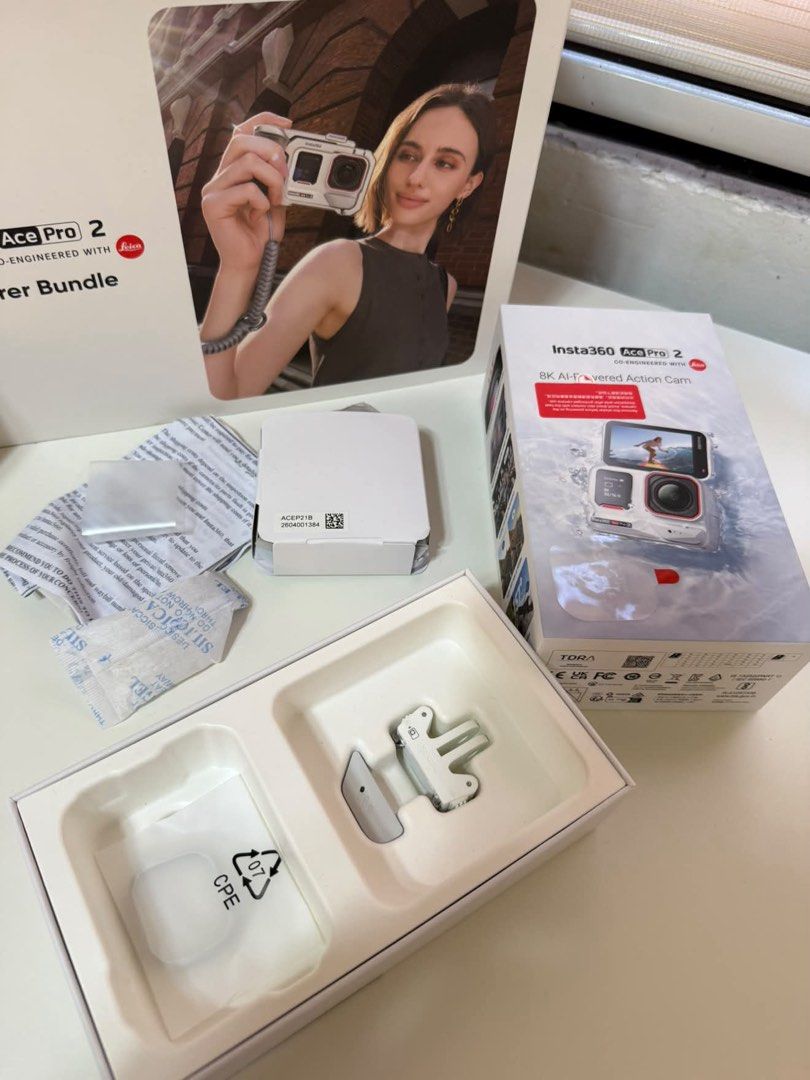 Insta360 Ace Pro 2 (Category: Video Cameras) located in Manila. Submitted by jstspotsk (Listing ID 1470223337, Image 2). Description: - Insta360 Ace Pro 2 action camera bundle in pristine condition - Includes main Xplorer Bundle box and Xplorer Grip Kit box - Comes with Tilta metal cage, grip handle, lanyard, and complete mounting hardware - 100% complete with all original packaging and components as pictured - Perfect for vloggers and adventure 