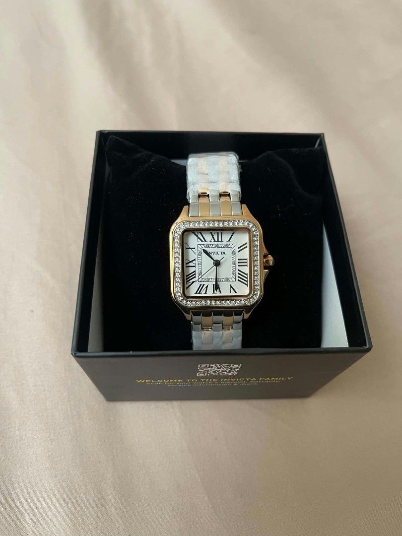 Invicta Square Crystal Roman Numeral Two-Tone Watch (Category: Women's Watches) located in Cavite. Submitted by vastowl_7d1ce5 (Listing ID 1470159669, Image 1). Description: - Brand new with original yellow box and all protective plastics intact - Unique square face design with a sparkling crystal bezel - Classic Roman numeral markers with a chic blue cabochon crown - Stunning two-tone bracelet strap in silver and rose gold - RUSH SALE / PM for i