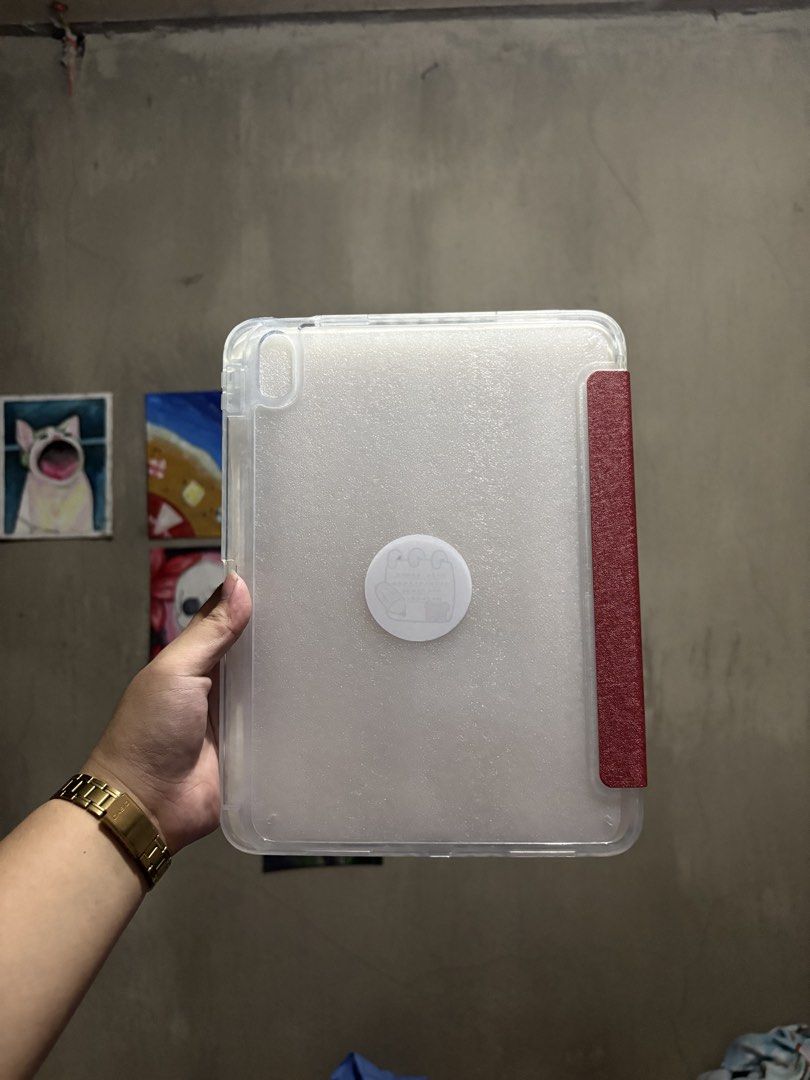 IPAD 10.9in A19 and 10th gen case (Category: Cases & Sleeves) located in Manila. Submitted by royalpengwen (Listing ID 1470306614, Image 2). Description: - Compatible with iPad 10.9-inch and 10th Generation models - Features a vibrant red trifold front cover with a cute white dog design - Frosted clear back shell for full body protection while showing off your iPad - BRAND NEW ON HAND - Provides secure protection against scratches and daily wear.