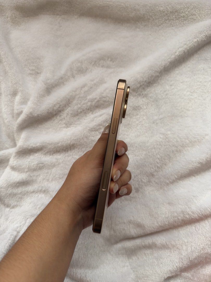 iPhone 16 Pro Max 512GB (Dessert Titanium) (Category: iPhone 16 Series) located in Muntinlupa City. Submitted by jllngnzls (Listing ID 1470295827, Image 3). Description: US Variant SIM: eSIM only Storage: 512GB Factory Unlocked / Openline Battery Health: 89% (Replaced Battery) Condition: Good Inclusions: Unit, chord and cases only Battery has been replaced; battery/part status is unverified. Price is negotiable for sure buyers..