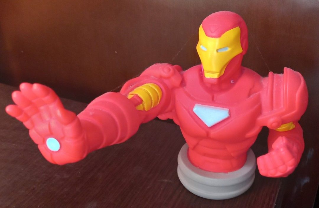 Iron Man Bust Figure Coin Bank (Category: Figurines & Statues) located in Cagayan de Oro. Submitted by edwardryan01984 (Listing ID 1470149110, Image 1). Description: - Iconic Iron Man character bust figurine - Classic red and yellow armor with a grey circular base - Dynamic pose with one arm raised in a repulsor blast - Durable solid plastic build - Minor dust on the surface, easily cleaned - Great addition for Marvel fans and collectors.