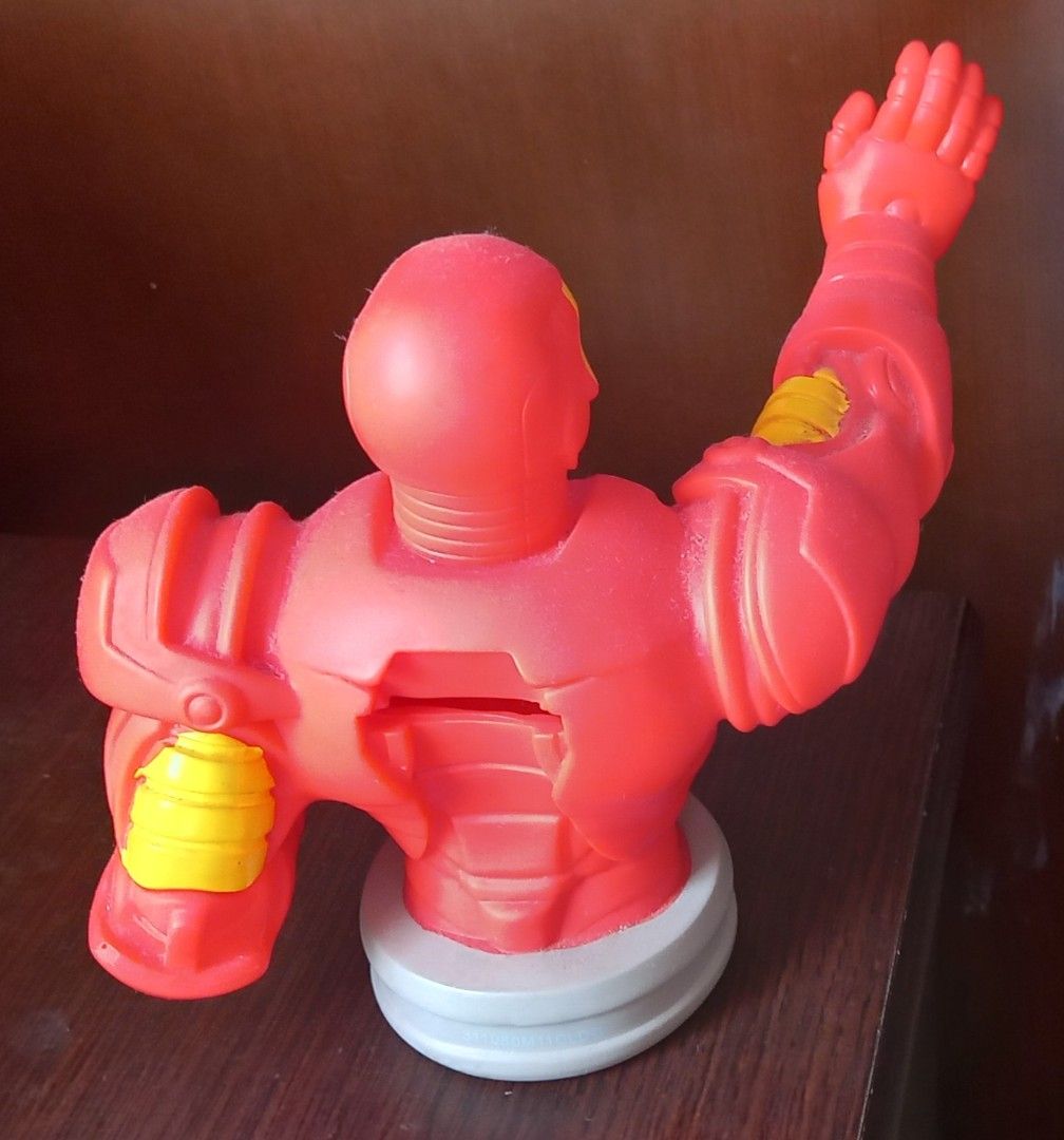 Iron Man Bust Figure Coin Bank (Category: Figurines & Statues) located in Cagayan de Oro. Submitted by edwardryan01984 (Listing ID 1470149110, Image 2). Description: - Iconic Iron Man character bust figurine - Classic red and yellow armor with a grey circular base - Dynamic pose with one arm raised in a repulsor blast - Durable solid plastic build - Minor dust on the surface, easily cleaned - Great addition for Marvel fans and collectors.