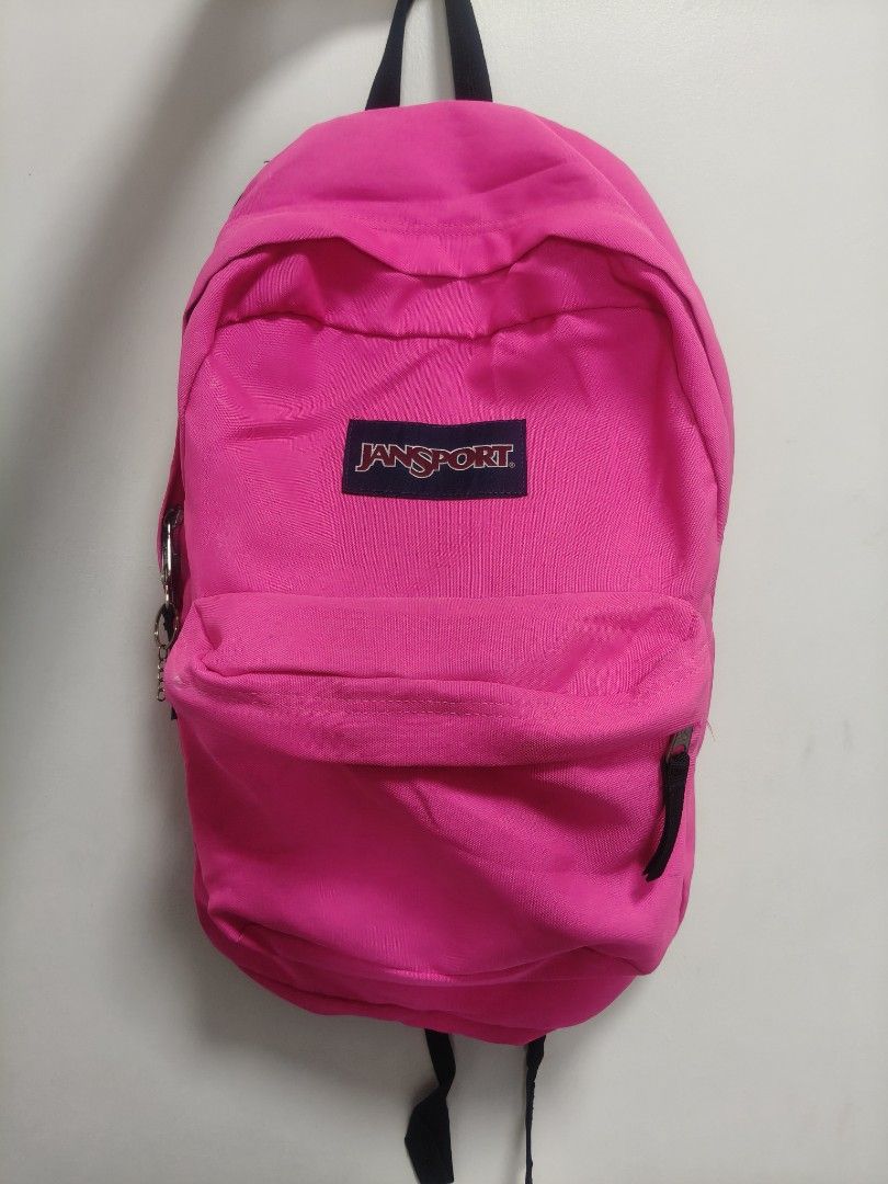 JanSport Pink Backpack (Category: Backpacks) located in San Fernando. Submitted by pollygirl08 (Listing ID 1470172255, Image 2). Description: - Authentic bright pink JanSport backpack - Front zippered pocket for extra storage and organization - Classic everyday design, perfect for school, commute, or travel - Made with durable fabric built to last - Overall clean condition with smooth, working zippers.