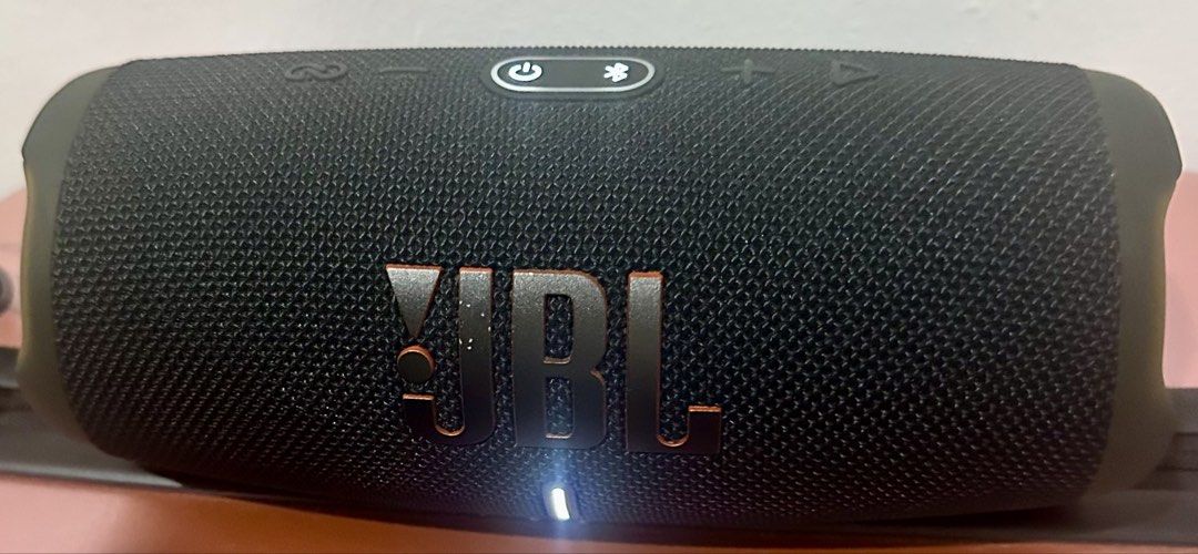 JBL Charge 5 Portable Bluetooth Speaker Black (Category: Soundbars, Speakers & Amplifiers) located in Mandaluyong City. Submitted by skol.le (Listing ID 1470325410, Image 2). Description: - Brand: JBL - Color: Black portable wireless speaker with bold front signature logo - Sound Quality: Delivers strong bass and clear audio for outdoor gatherings, parties, and everyday listening - Controls & Ports: Convenient top-panel power and bluetooth button