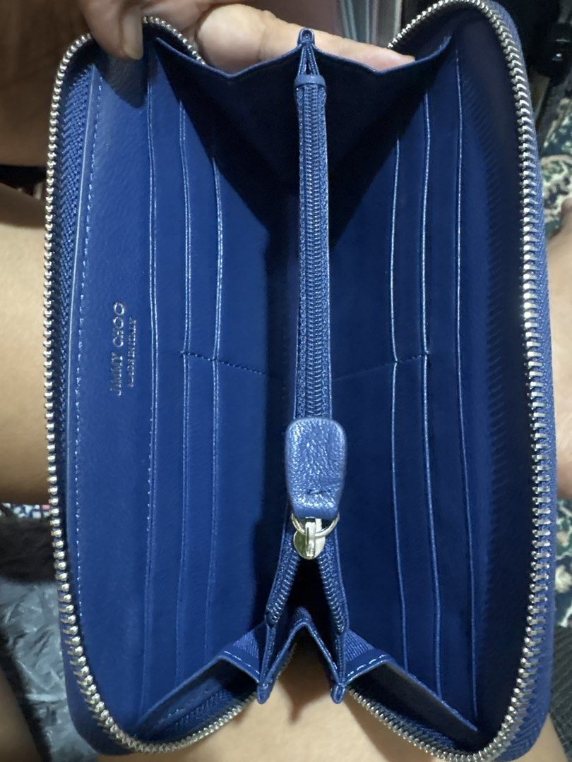 Jimmy Choo (Category: Wallets & Card holders) located in Cordova. Submitted by cb_bagz_n_bloom (Listing ID 1470308451, Image 3). Description: Chic deep blue zip-around wallet featuring edgy silver star studs. Offers plenty of space for cards and cash. A stylish and practical everyday accessory with great character!.