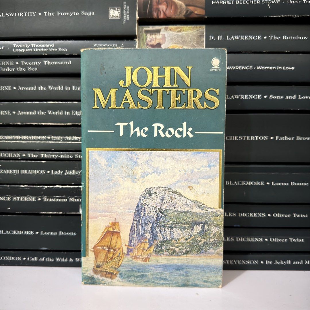 John Masters The Rock Sphere Paperback Novel (Category: Storybooks) located in Lingayen. Submitted by readwjane (Listing ID 1470199397, Image 1). Description: - Title: The Rock by John Masters - Publisher: Sphere - Format: Vintage paperback with classic sailing ship cover art - Aesthetics: Green spine and top banner with gold embossed author name - Condition: Sturdy intact binding with minor page tanning consistent with age - Ideal for: Vintage f