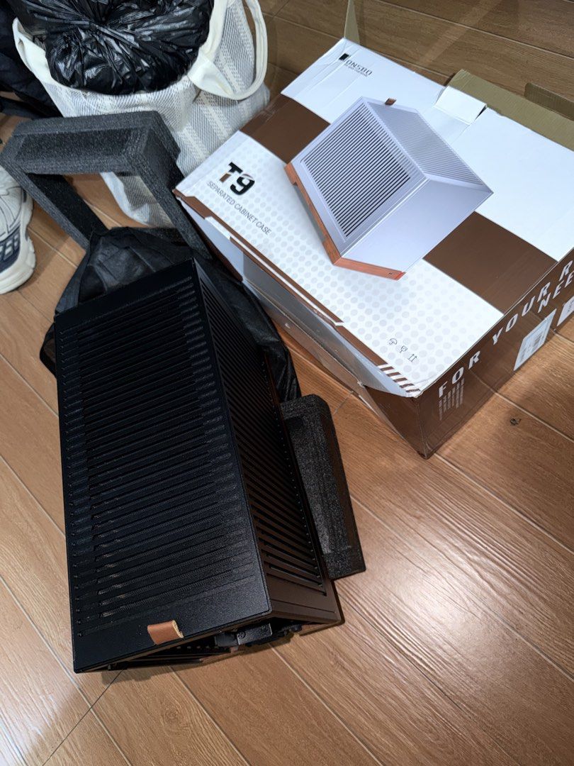 Jonsbo T9 Premium Mini-ITX SFF Case (Black) (Category: Desktops) located in Licab. Submitted by kmbrgz (Listing ID 1470151425, Image 3). Description: • Form Factor Layout: Sandwich A4 Style (Dual-Chamber) • Case Volume: Compact 11.28 Liters • Dimensions: 155 mm (W) × 325 mm (D) × 224 mm (H) • Net Weight: 3.85 kg • Materials: 4 mm Heavy-duty Aluminum Alloy + 1 mm Steel Frame + 20 mm Solid Walnut Base • Motherboard Support: Mini-ITX • Power Supply 