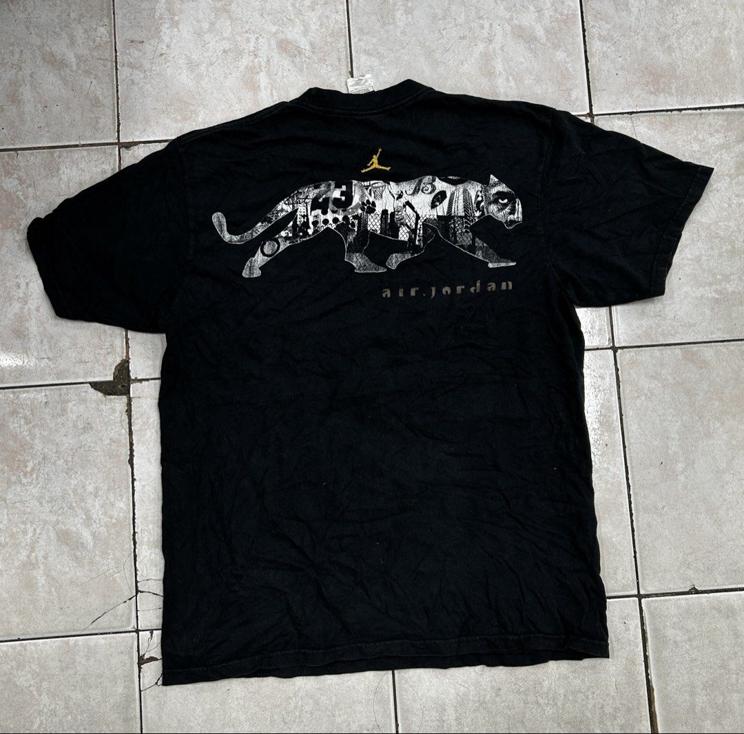Jordan Black Cat Graphic T-Shirt (Category: Shirts) located in Cebu City. Submitted by jkeive (Listing ID 1470197563, Image 2). Description: - Brand: Jordan - Style: Black Cat Tee - Color: Black - Size: Large (L) - Material: 100% Cotton (Made in Mexico) - Design: Large Michael Jordan cityscape graphic on front; Panther and Jumpman logo on the back - Fit: Standard short sleeve crewneck - Condition: Clean piece overall.