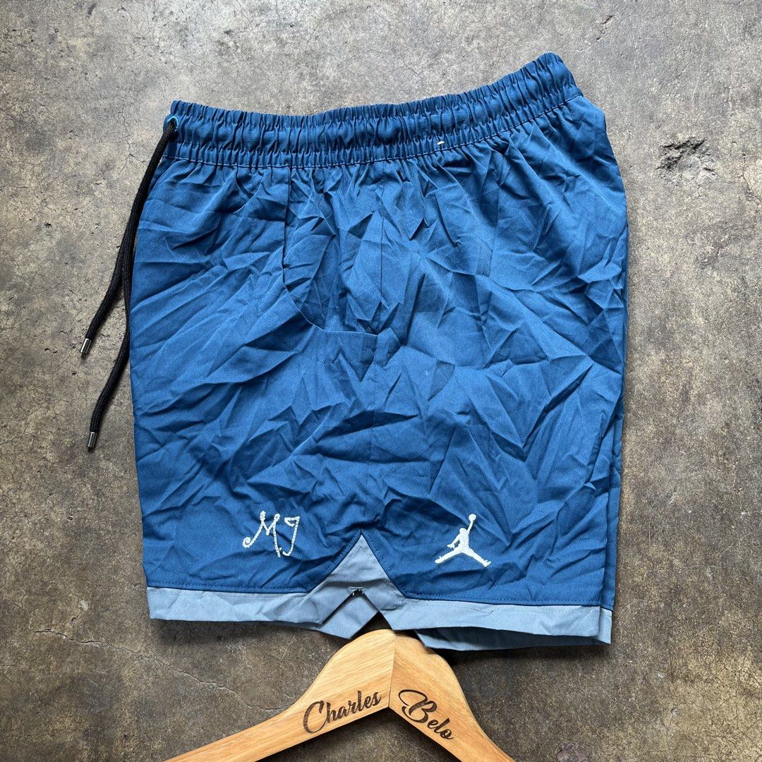 Jordan Blue Athletic Shorts (Category: Shorts) located in Davao. Submitted by charlesole52665 (Listing ID 1470184912, Image 3). Description: - Brand: Jordan - Color: Blue with light blue hem trim - Size: XS - Waistline: 22-26 on tape - Length: 13 inch - Material: Lightweight polyester - Features: Drawstring waistband with black cords and metal tips - Branding: Embroidered Jumpman logo and MJ signature on lower left leg - Origin: Made in Thailand 
