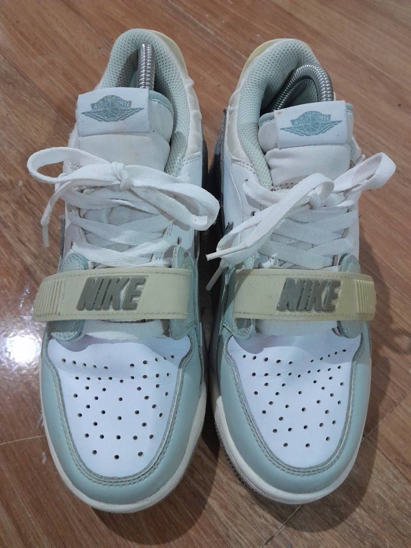 Jordan Legacy 312 Low White Light Blue (Category: Sneakers) located in Calamba. Submitted by ysabellascloset17 (Listing ID 1470346355, Image 3). Description: - Model: Jordan Legacy 312 Low - Colorway: White, light blue, and grey - Design details: Classic elephant print wrap at the back heel and forefoot strap with Nike branding - Branding: Jumpman logo on the tongue and heel tab - Comfort: Air unit in the midsole - Condition: Soles show normal si