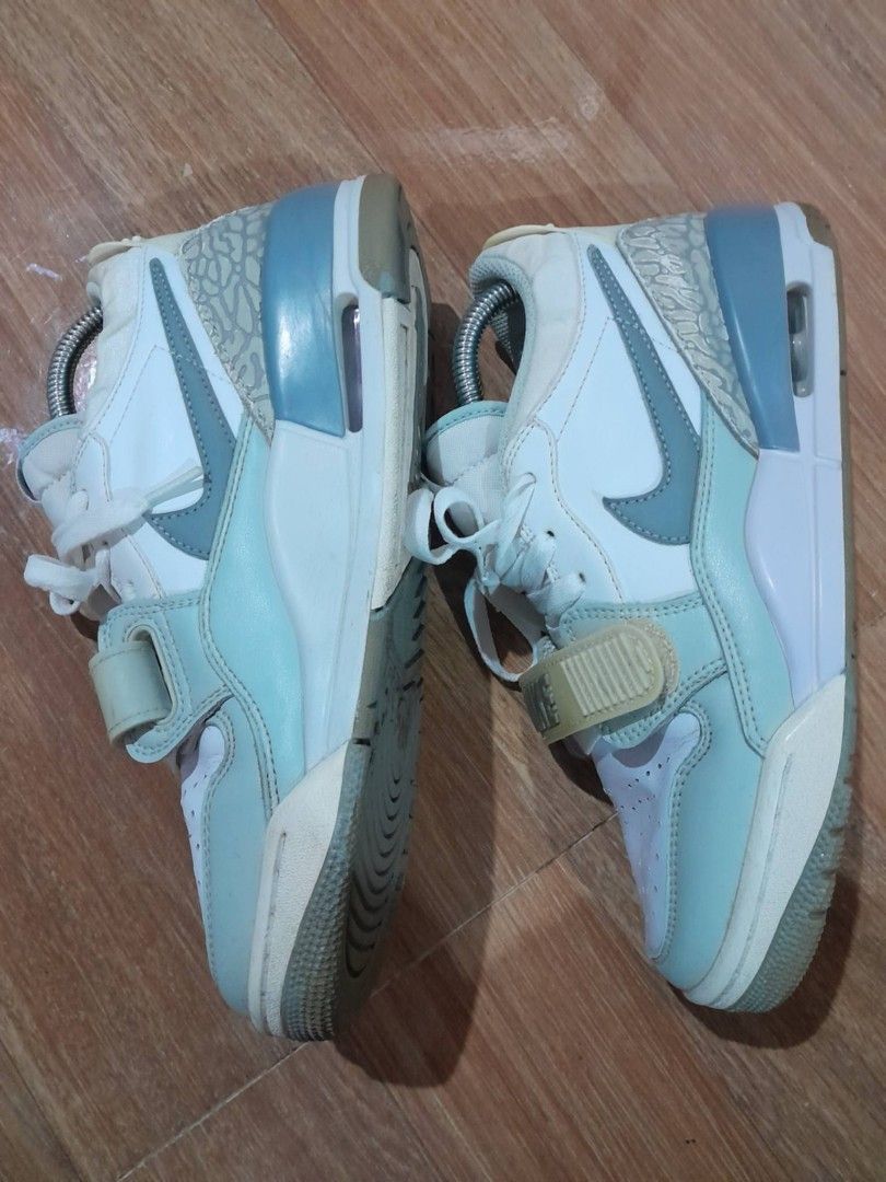 Jordan Legacy 312 Low White Light Blue (Category: Sneakers) located in Calamba. Submitted by ysabellascloset17 (Listing ID 1470346355, Image 2). Description: - Model: Jordan Legacy 312 Low - Colorway: White, light blue, and grey - Design details: Classic elephant print wrap at the back heel and forefoot strap with Nike branding - Branding: Jumpman logo on the tongue and heel tab - Comfort: Air unit in the midsole - Condition: Soles show normal si