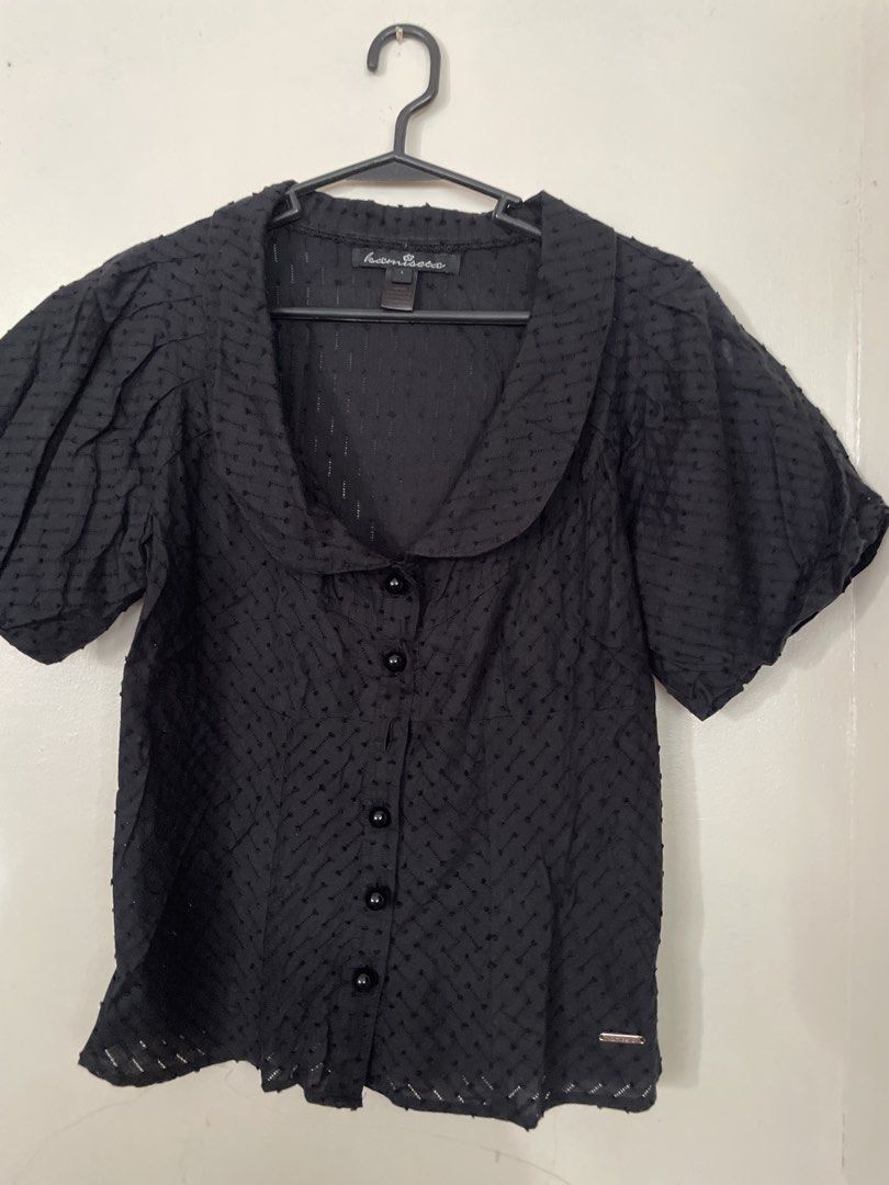 Kamiseta Black Button-Up Blouse Size L (Category: Blouses) located in San Juan City. Submitted by redrosierose (Listing ID 1470150888, Image 1). Description: - Brand: Kamiseta - Size: Large - Color: Black - Design: Short puff sleeves, nice collar, front button closure, and textured dot pattern - Details: Metal brand tag near the bottom hem - Care Instructions: Hand wash only RFS: Decluttering LOC: San Juan City MOP: Bank Transfer / Gcash ❎no rush