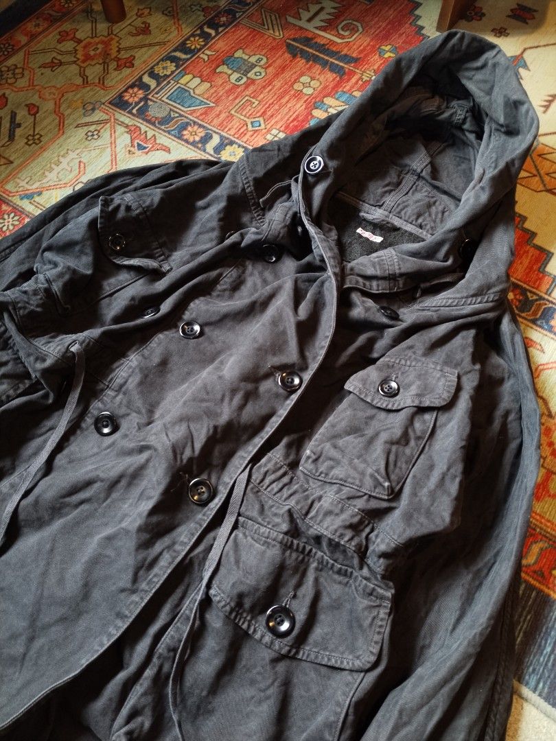 Kapital Japan Katsuragi Ring Coat (Category: Coats, Jackets and Outerwear) located in Pasig City. Submitted by loveforlux_2025 (Listing ID 1470236263, Image 2). Description: - Authentic Kapital jacket straight from Japan - Dark charcoal black wash with heavy utility styling - Double-breasted button closure with drawstring waist and hem - Multiple chest and lower body flap pockets - Hooded design with ribbed inner cuffs - Thick woolly fleece linin