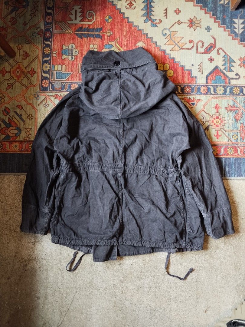 Kapital Japan Katsuragi Ring Coat (Category: Coats, Jackets and Outerwear) located in Pasig City. Submitted by loveforlux_2025 (Listing ID 1470236263, Image 3). Description: - Authentic Kapital jacket straight from Japan - Dark charcoal black wash with heavy utility styling - Double-breasted button closure with drawstring waist and hem - Multiple chest and lower body flap pockets - Hooded design with ribbed inner cuffs - Thick woolly fleece linin