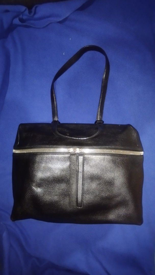 KARA PEBBLE LEATHER SHOULDER/ HANDBAG (Category: Tote Bags) located in Manila. Submitted by beckster_online_luxuryshop (Listing ID 1470265807, Image 1). Description: KARA PEBBLE LEATHER BAG - Color & Material: Black textured leather - Hardware: Chunky silver-tone zippers on front and top - Straps: Double shoulder straps plus a shorter top handle - Interior: Fabric-lined with built-in pockets and brand tag - Origin: Made in China - Usage: Roomy an