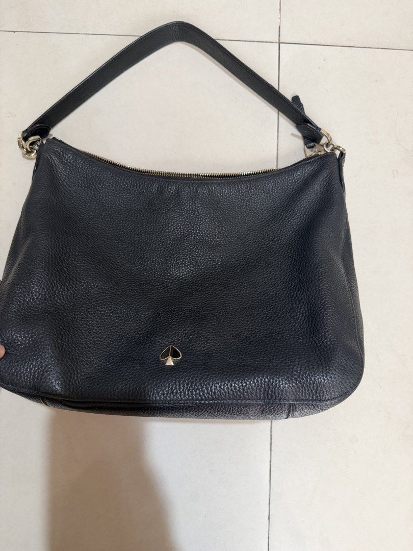 Kate Spade Black Pebbled Leather Shoulder Bag (Category: Luxury Bags & Wallets) located in Paranaque City. Submitted by mryjwll (Listing ID 1470178521, Image 2). Description: - Brand: Kate Spade New York - Material: Premium black pebbled leather with gold-tone hardware - Closure: Secure top zipper closure - Pockets: Convenient front slip pocket with gold foil embossed logo - Details: Signature metal spade logo on the back - Strap: Single shoulder