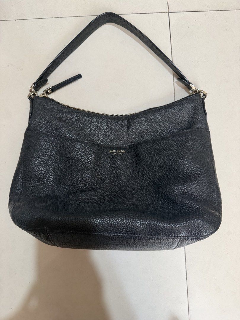 Kate Spade Black Pebbled Leather Shoulder Bag (Category: Luxury Bags & Wallets) located in Paranaque City. Submitted by mryjwll (Listing ID 1470178521, Image 1). Description: - Brand: Kate Spade New York - Material: Premium black pebbled leather with gold-tone hardware - Closure: Secure top zipper closure - Pockets: Convenient front slip pocket with gold foil embossed logo - Details: Signature metal spade logo on the back - Strap: Single shoulder