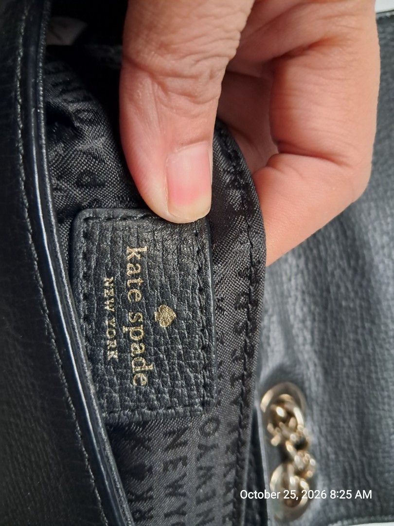Kate Spade Briar Lane Original (Category: Cross-body Bags) located in Naga. Submitted by forsaleitems2 (Listing ID 1470144781, Image 3). Description: - Brand: Kate Spade New York - Material: Premium black pebbled leather - Closure: Flap with secure magnetic snap - Strap: Elegant chain strap included - Interior: Black monogram fabric lining with leather logo patch - Tags: Includes original fabric care tag and style tag (S338) - Condition: Excellen